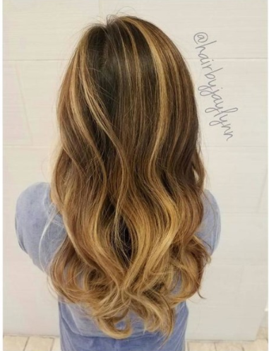 Why Your "Healthy" Hair Needs an Olaplex Treatment | Instagram image of long, wavy hair with subtle highlights