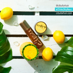 Protect Summer Hair | Image of Cibu Sashini on pool deck with palm froms and lemons