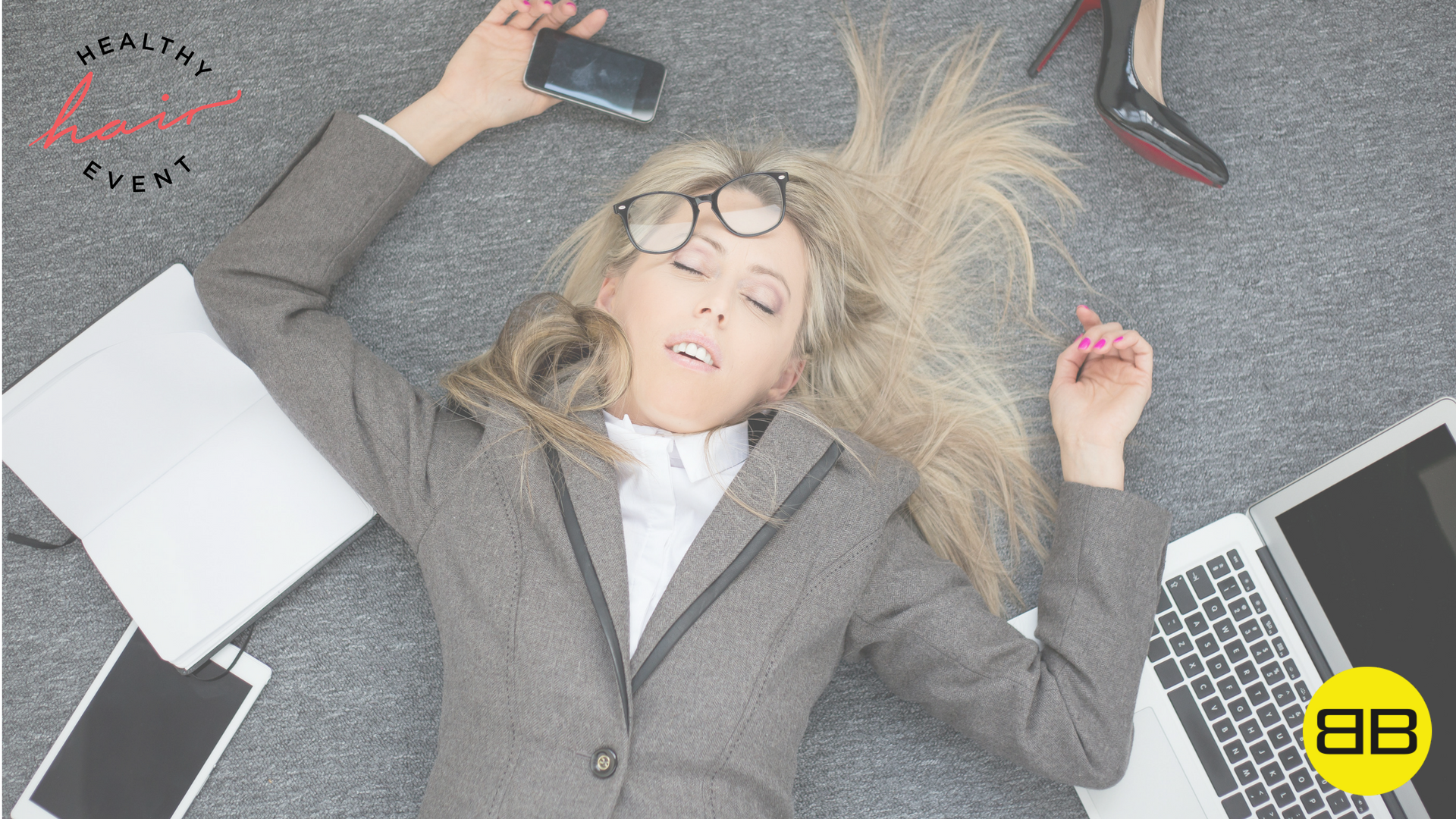 Top 3 Ways Stress Wrecks Your Hair | Image of stressful woman on the floor surrounded by digital devices